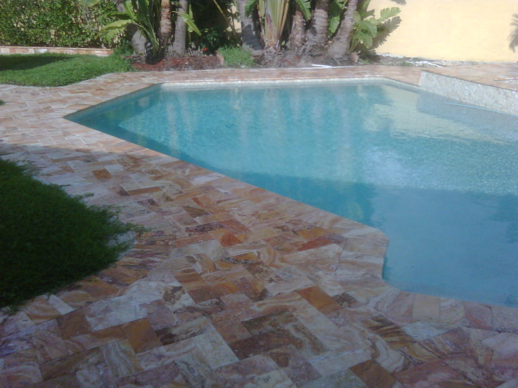 Chiseled Edge Travertine Paver pool deck installed