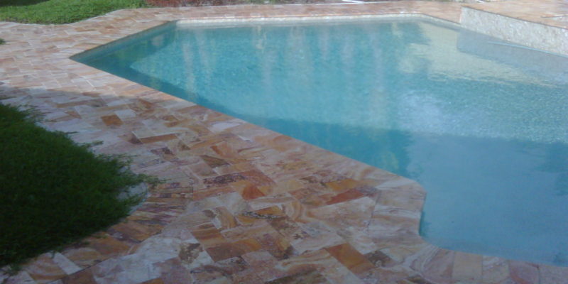 Chiseled Edge Travertine Paver pool deck installed