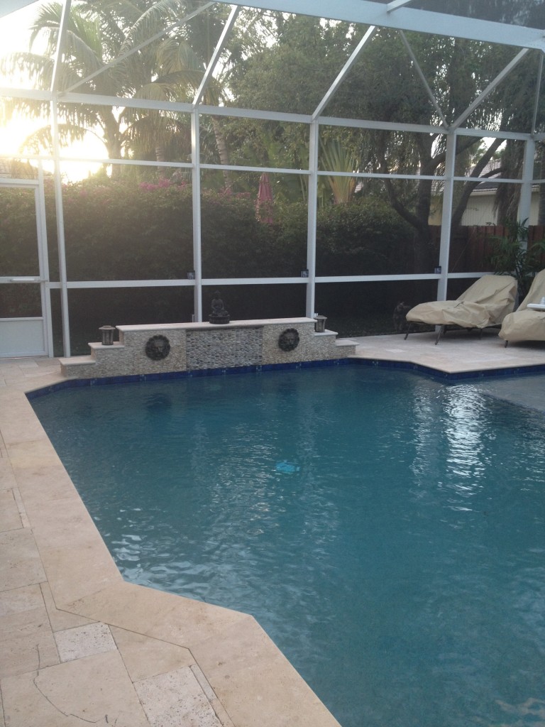 Tumbled travertine pavers around pool