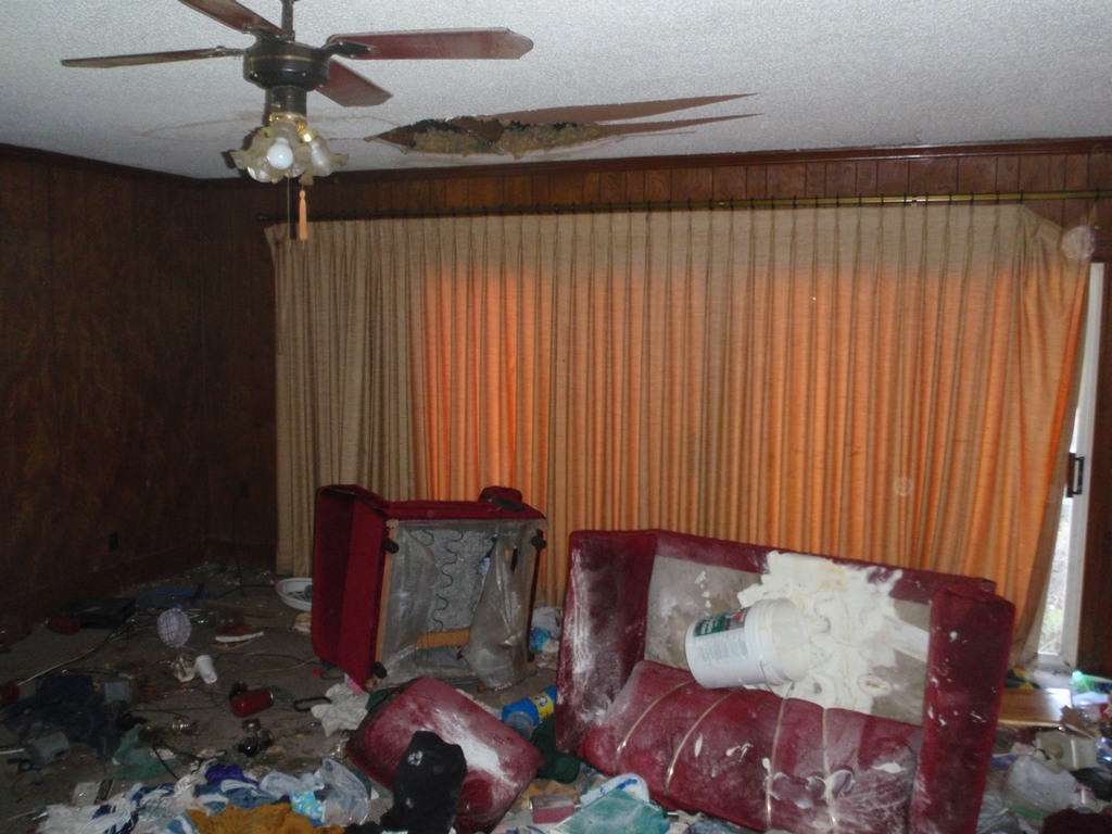 R.E.O. Property living room requiring trash-out