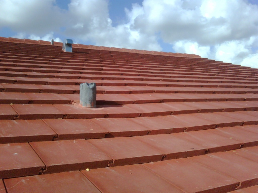Close-up of new roof tiles on complete roof repair