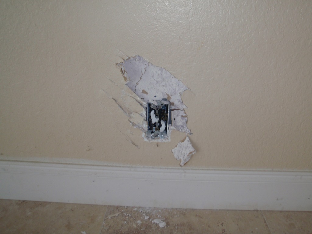 Wall outlet vandalized in R.E.O. home