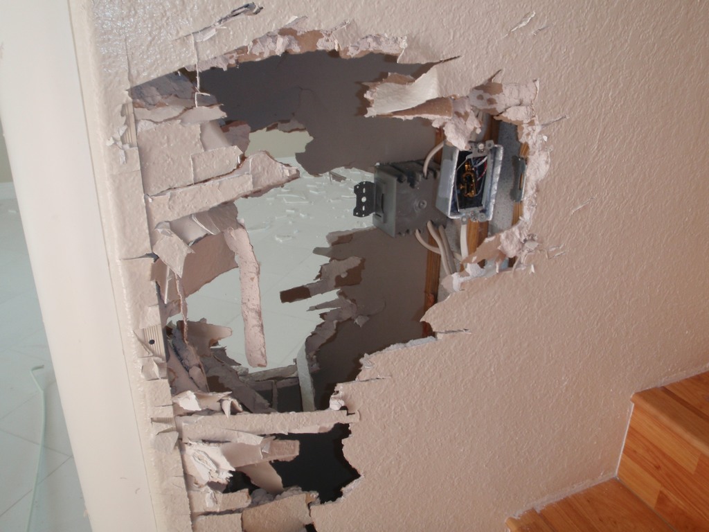 Interior wall vandalized in R.E.O. home