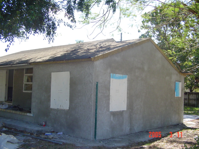 Side of home with cement stucco finish