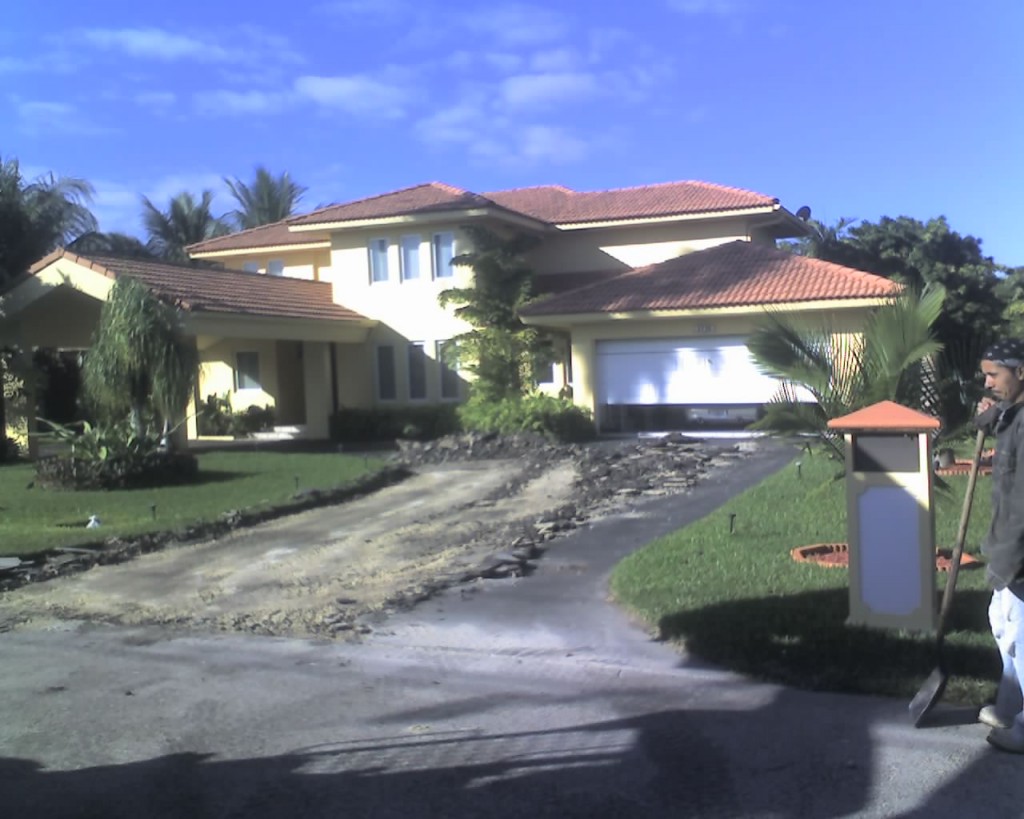 Driveway demolition before travertine paver installation