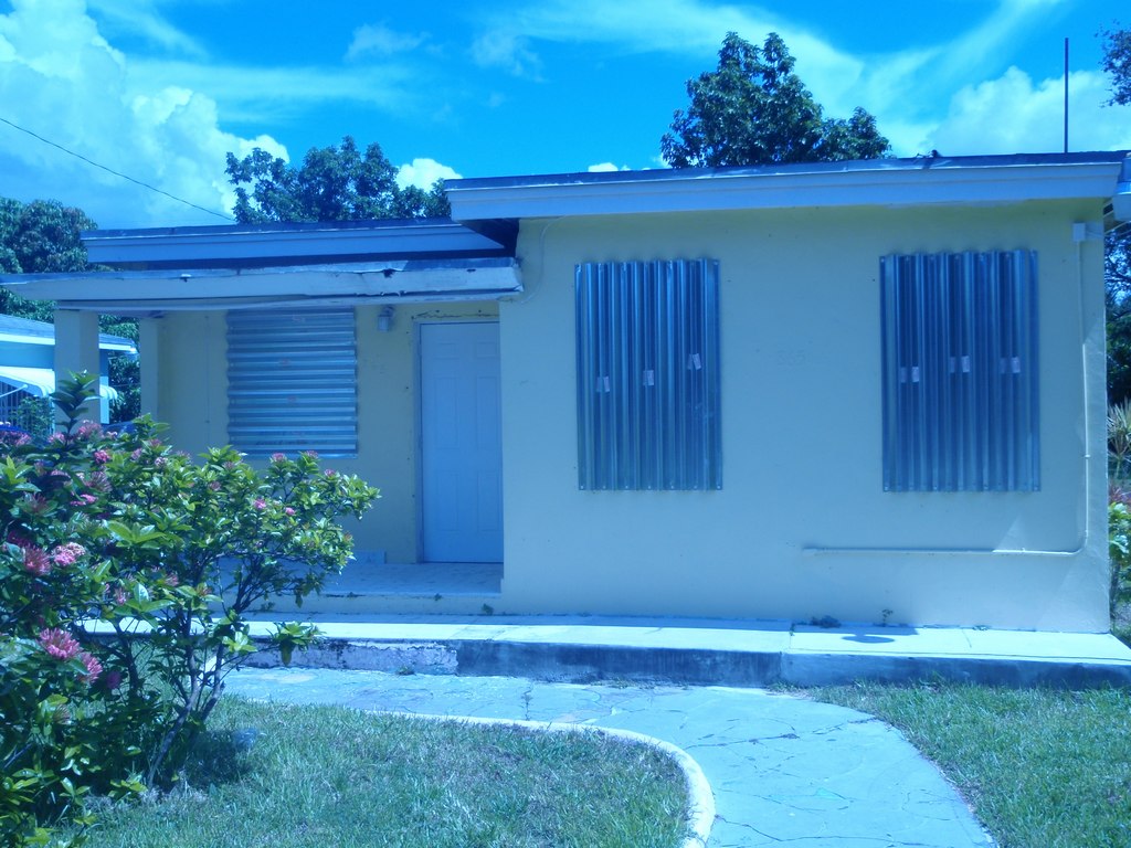 After photo of R.E.O. property with code compliant windows & shutters