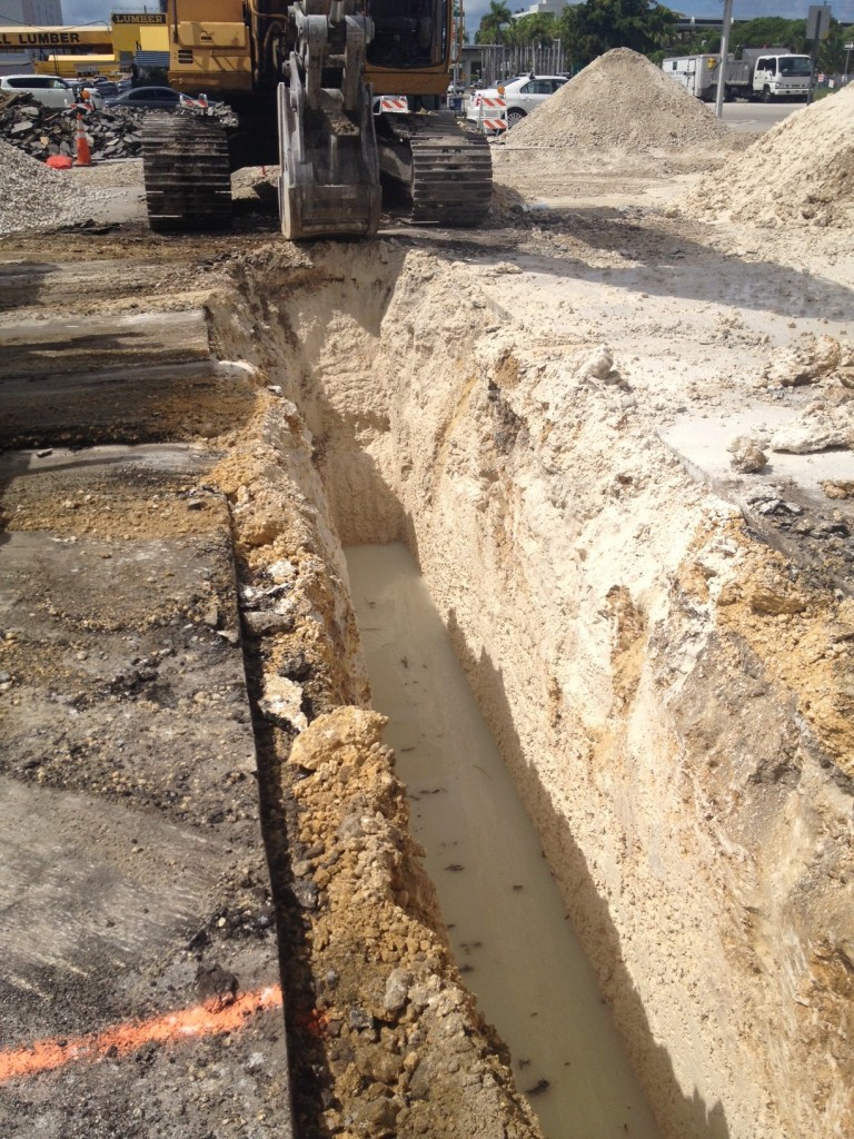 15 foot deep drainage trench for commercial parking lot