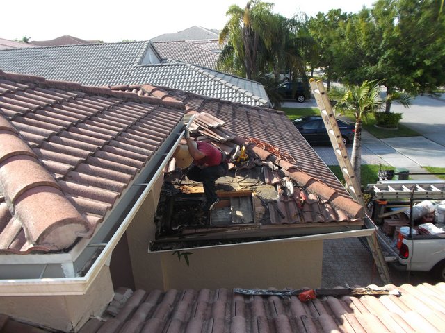 Entrance roof tiles being removed
