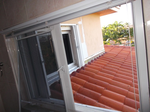 Repaired roof leak and roof tiles