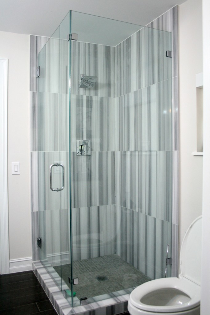 Shower with modern tile in new guest bathroom in Pinecrest