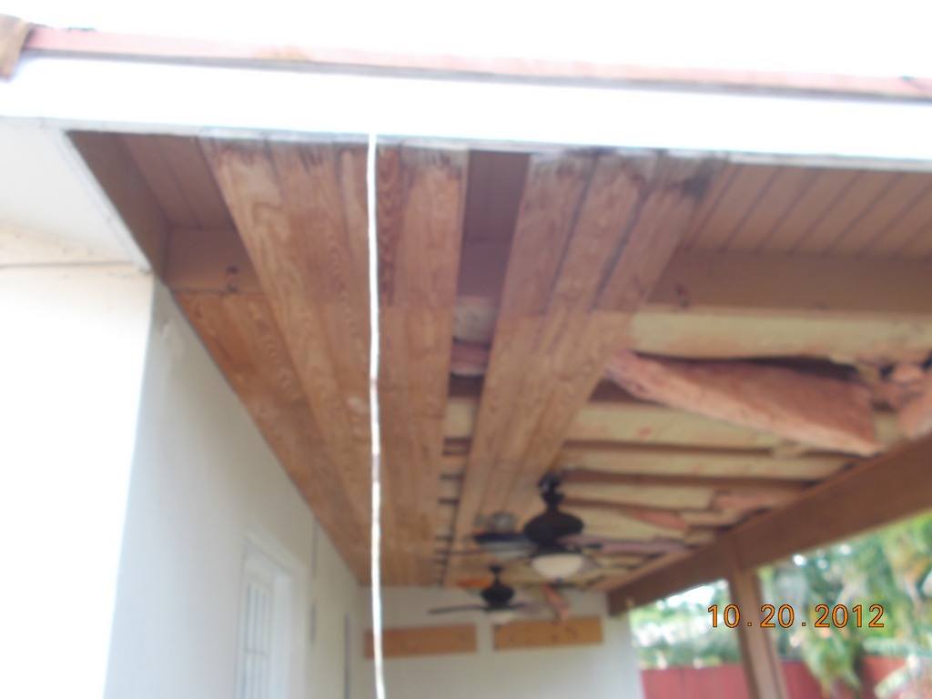 Photo of damaged patio roof during the repair process