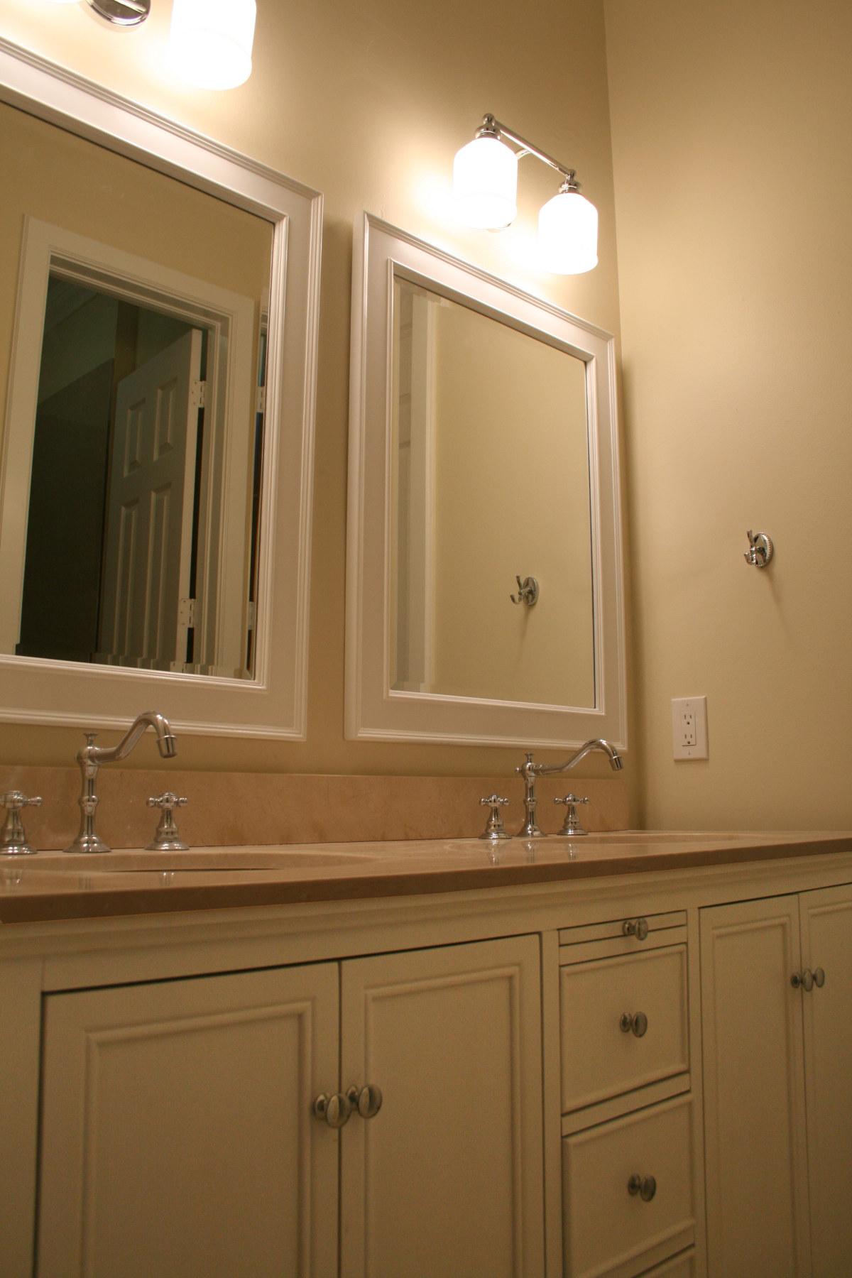 New Vanity after interior remodel with new faucets, quartz counter top, mirrors and lights