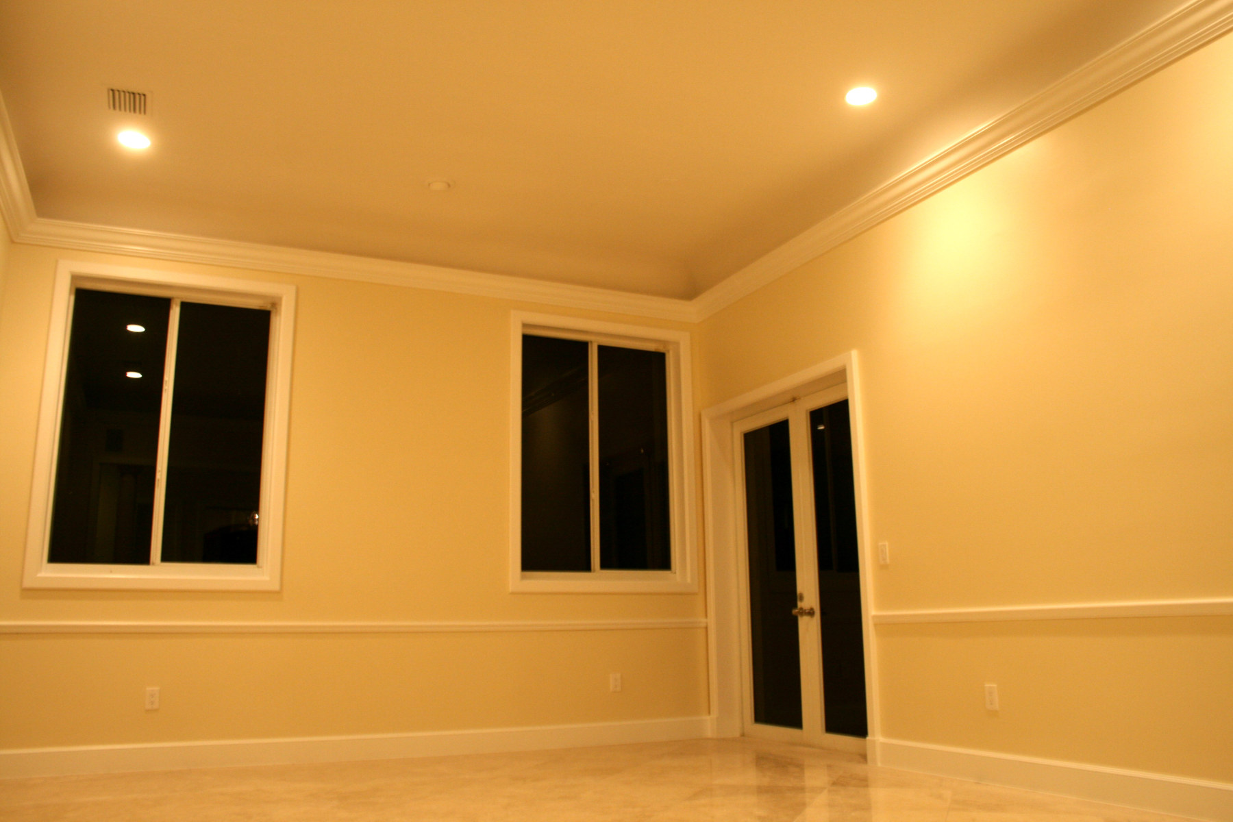 Interior paint at Living Room with high ceilings and crown molding