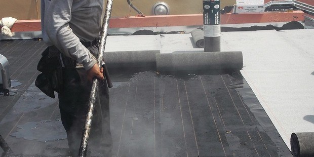Cap sheet installation on flat roof