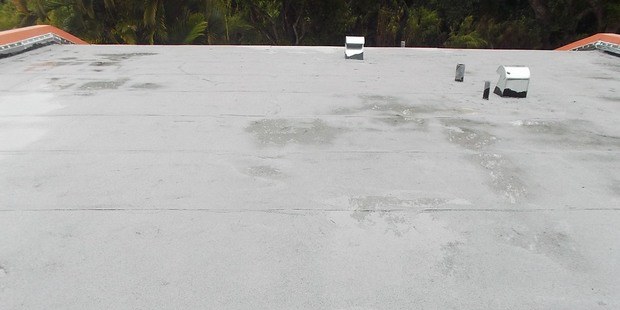 Finalized flat roof after cap sheet installation
