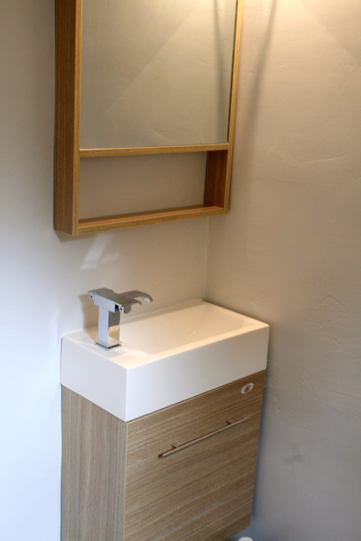 Italian style wall-mounted vanity at Guest Bathroom