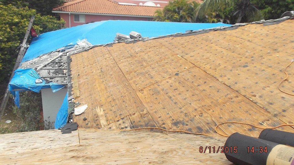 Removal of existing roof tile & tarp