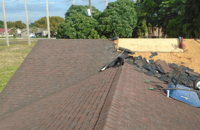 Removal of old shingle roof after atrium was sealed