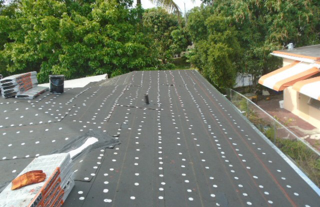 Roofing paper and tin cap installed