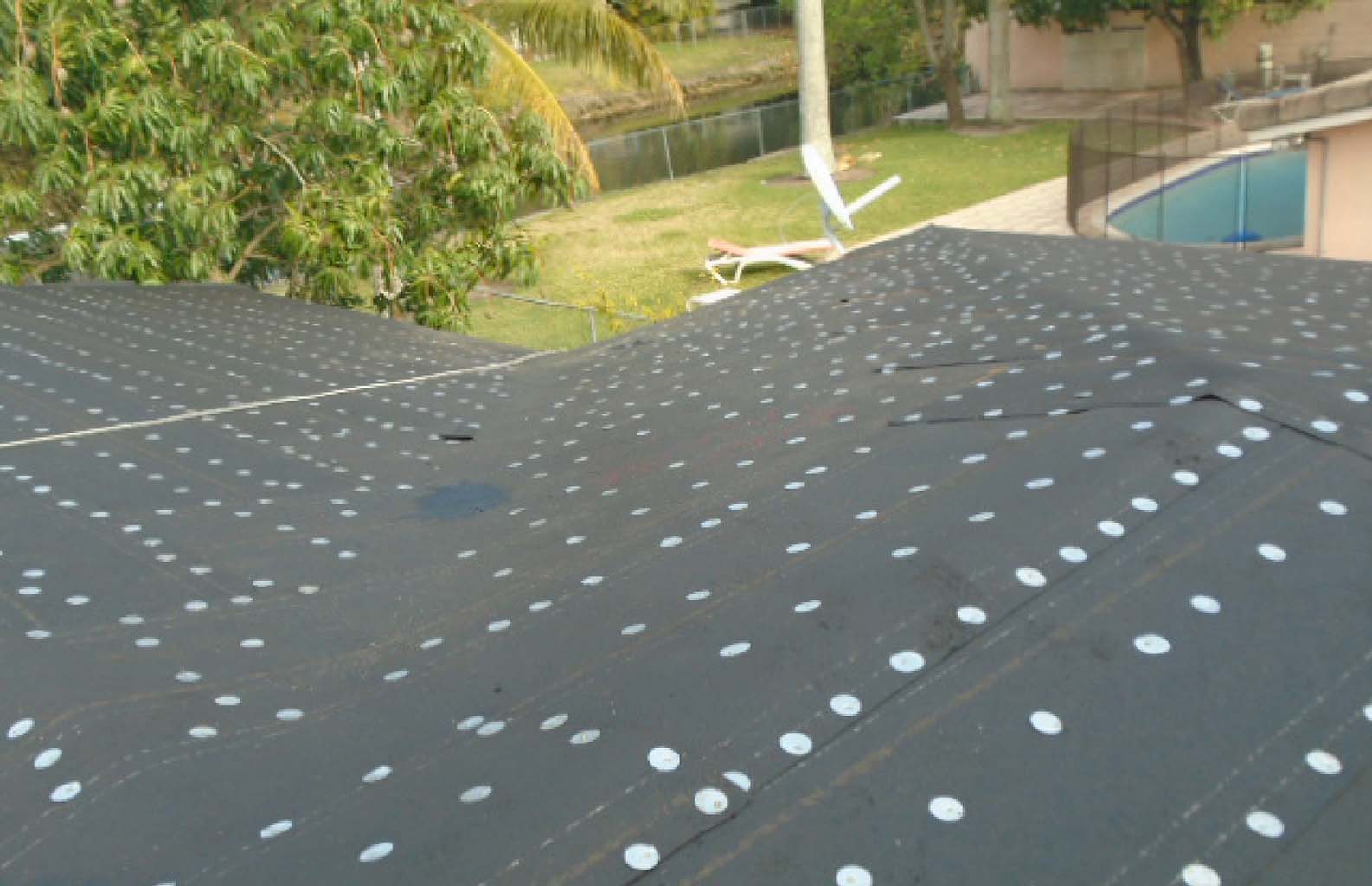 Installation of roofing paper & tin-cap over fire barrier