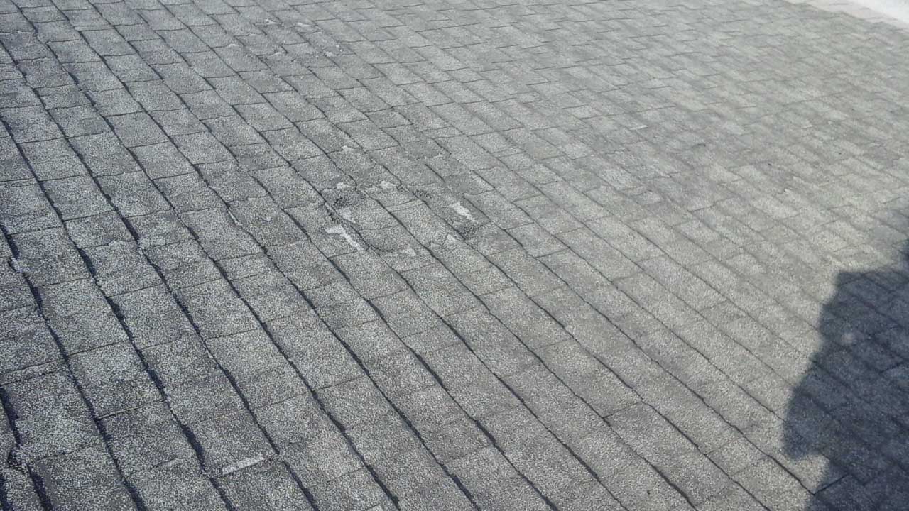 Old & weathered shingle roof before removal