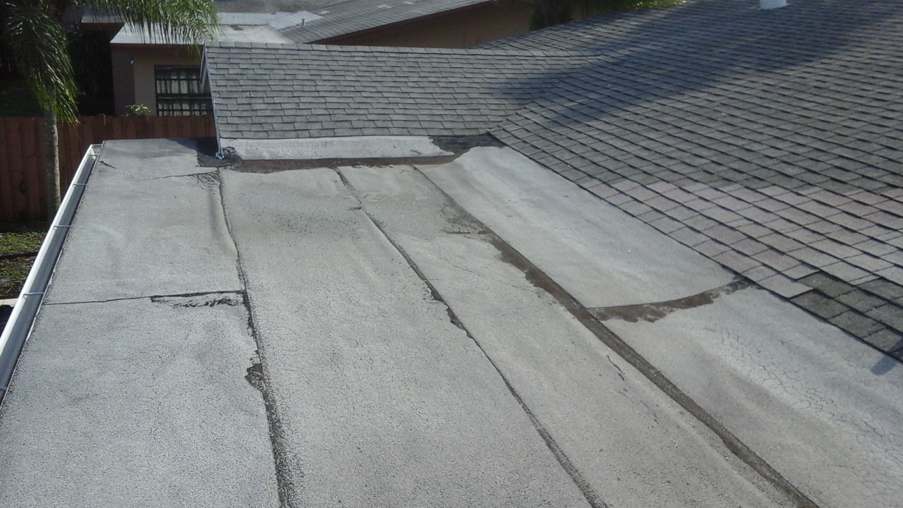 Old & weathered flat roof before replacement