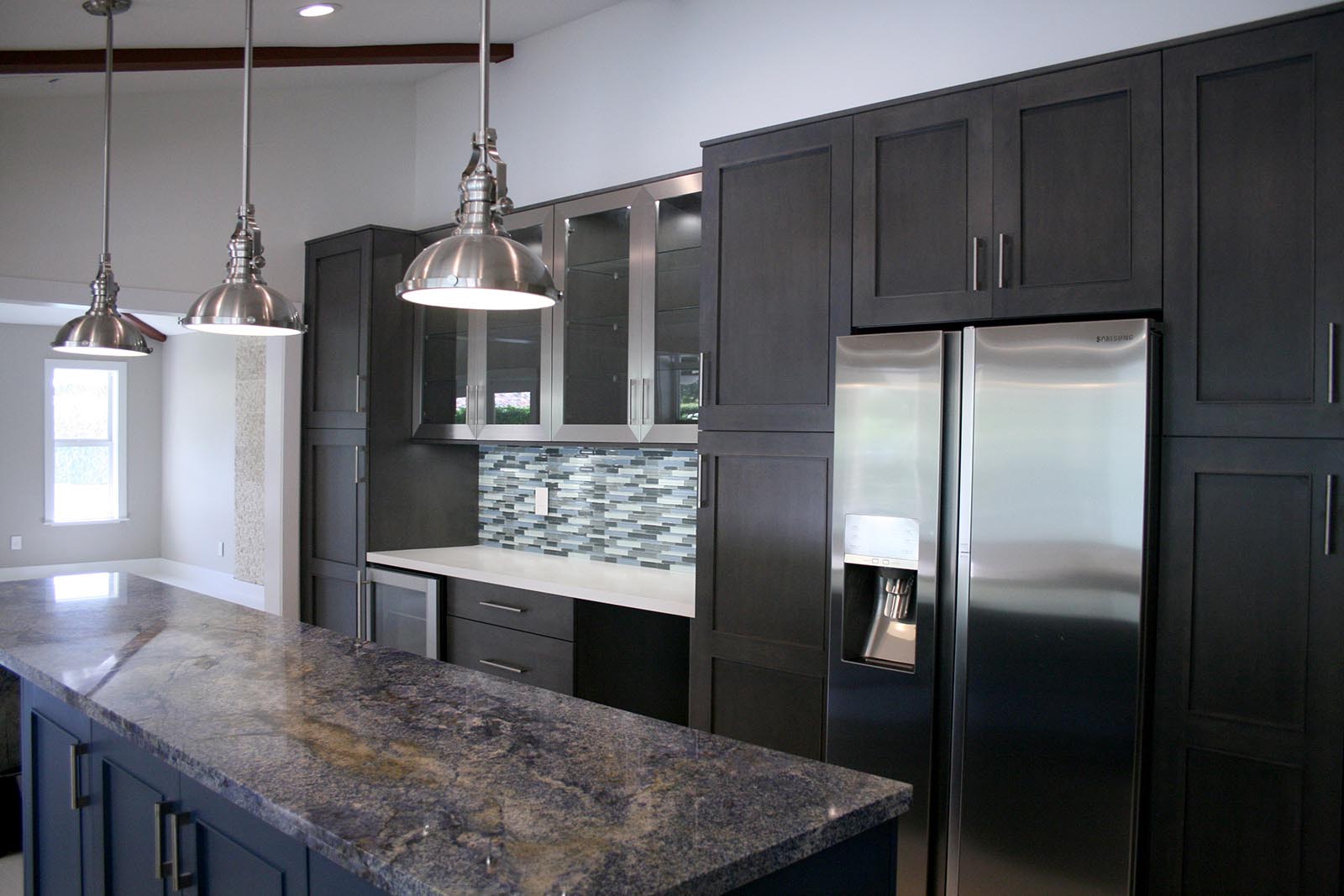 Omega cabinets with white quartz & blue granite counter top