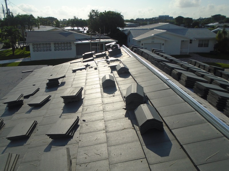Flat tile roof replacement in progress