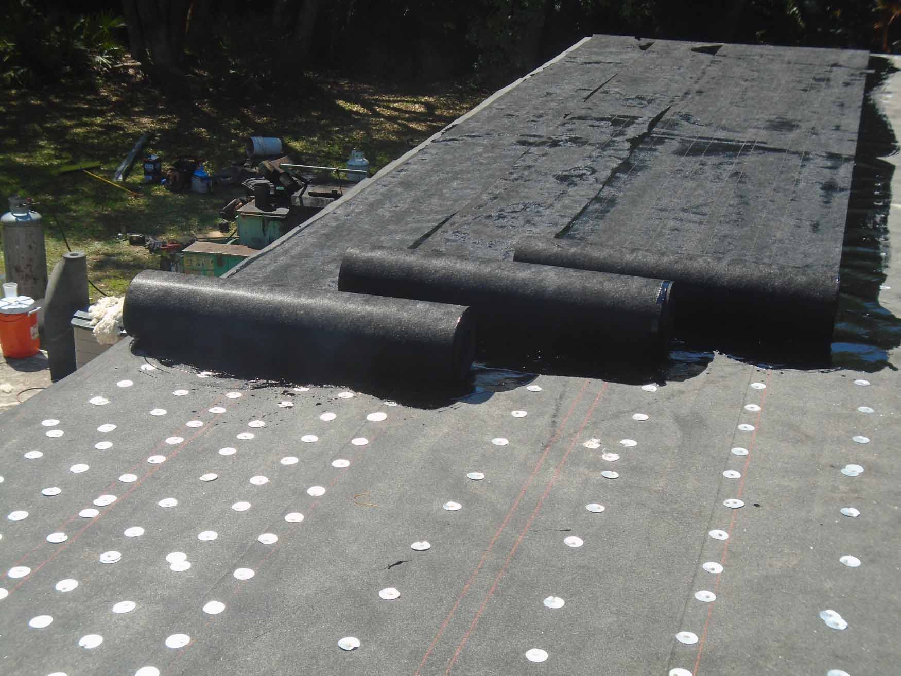 Fiberglass layers installed over flat roof