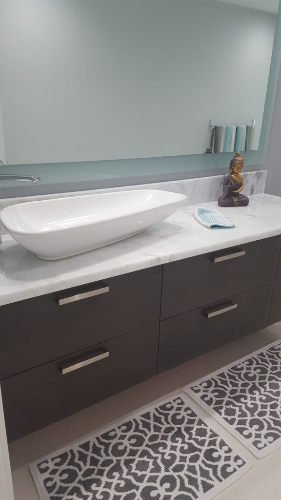 After photo of floating vanity with vessel sink