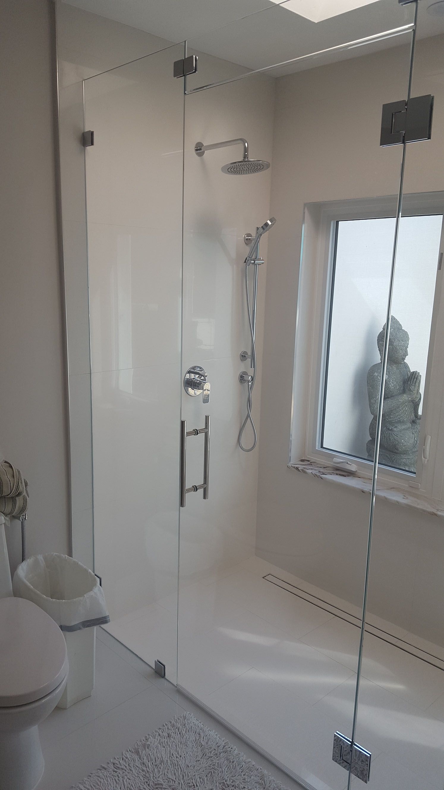 New shower with frameless glass enclosure
