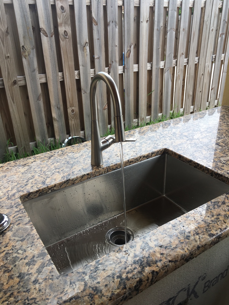 New sink at granite countertop bar