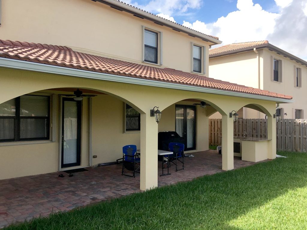 Finished Covered Patio with tile roof, paver floor & bar