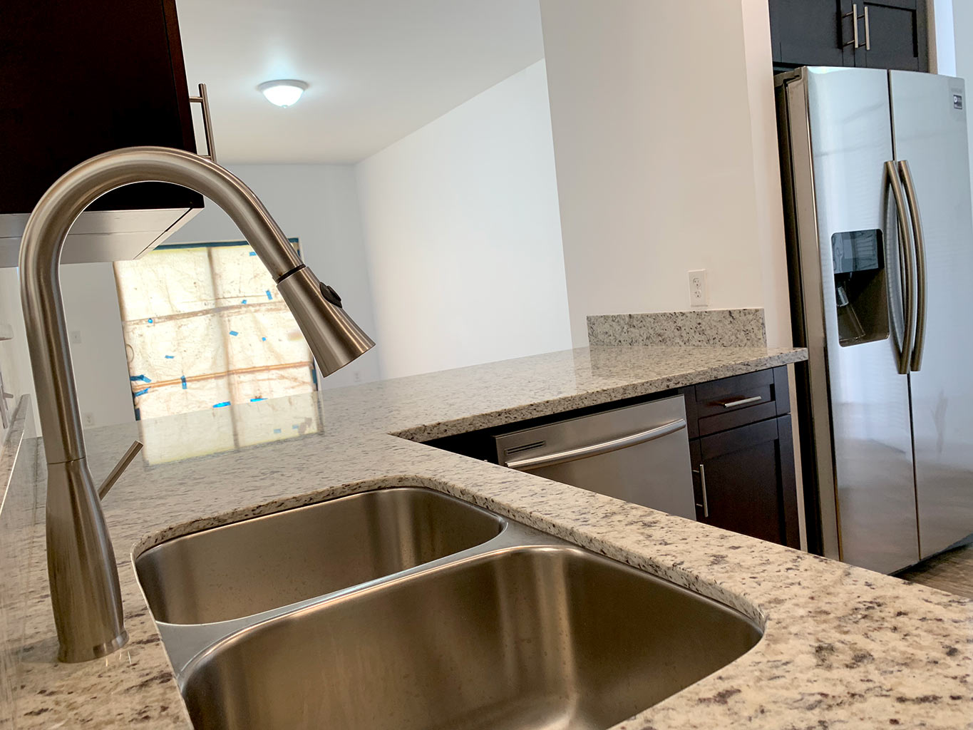 Close-up photo of finished granite counter top with undermount kitchen sink
