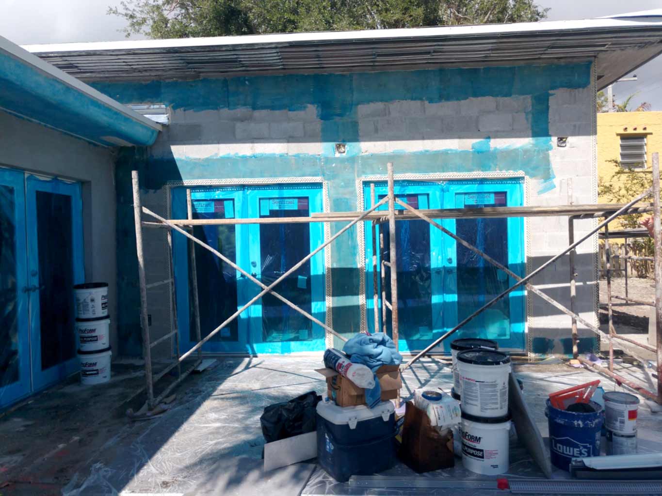 Windows and doors protected for smooth-finish stucco application