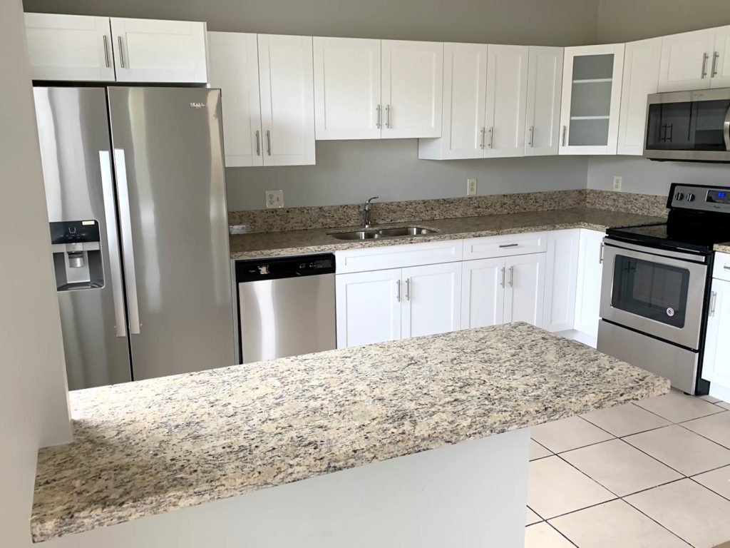 After photo of new white shaker kitchen cabinets