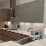 After photo of undermount sink with apron and quartz countertop