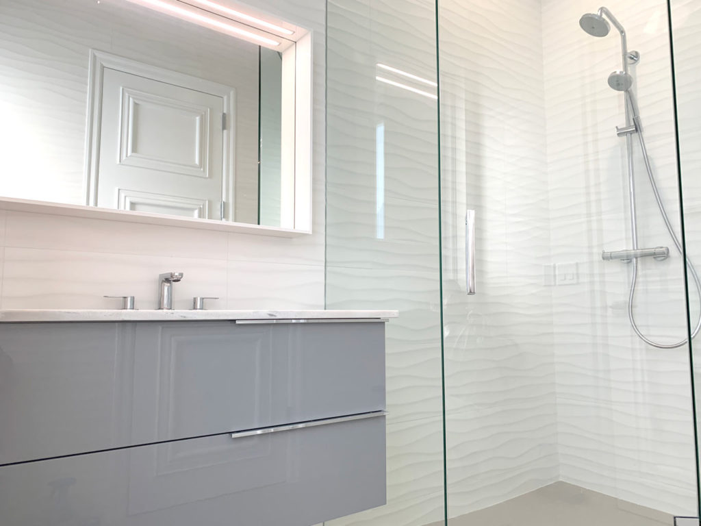 Cabana bathroom remodel with wavy tile walls