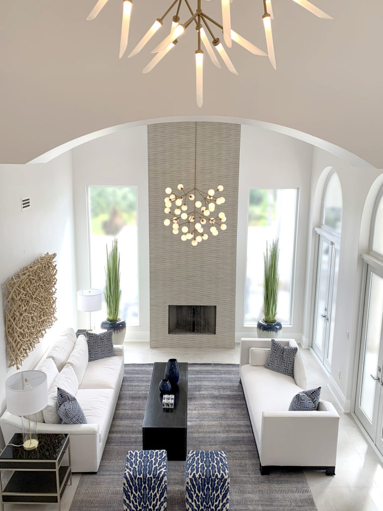 Renovated living room with fireplace, impact windows & doors