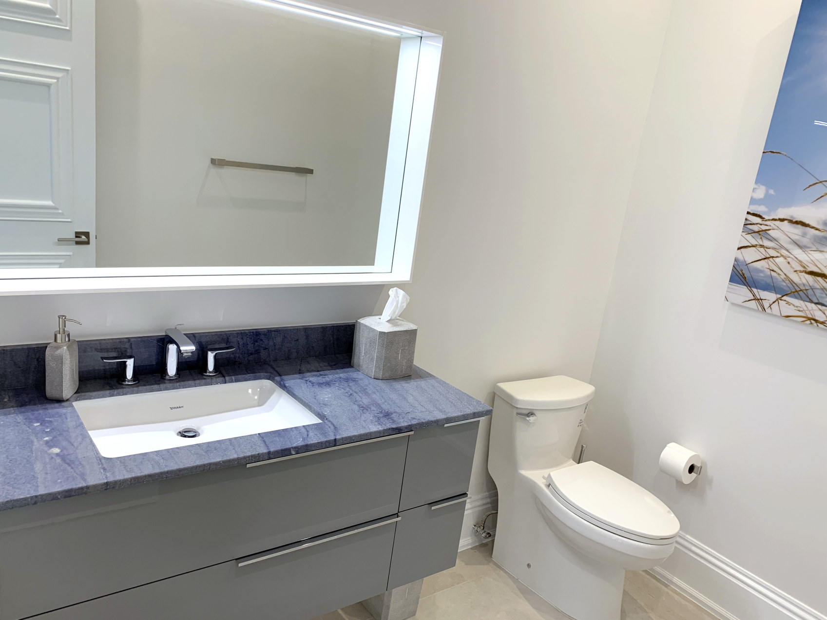 Half bathroom with floating vanity and Blue Macauba granite countertop