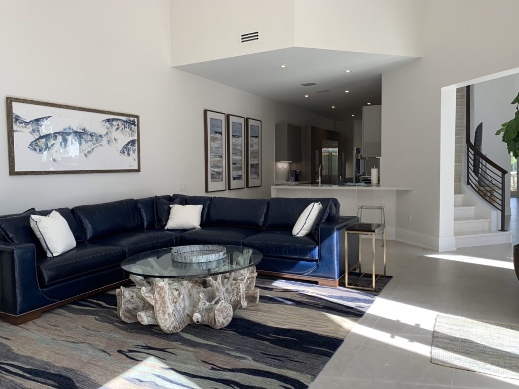 Family room with kitchen and foyer stairs in the background