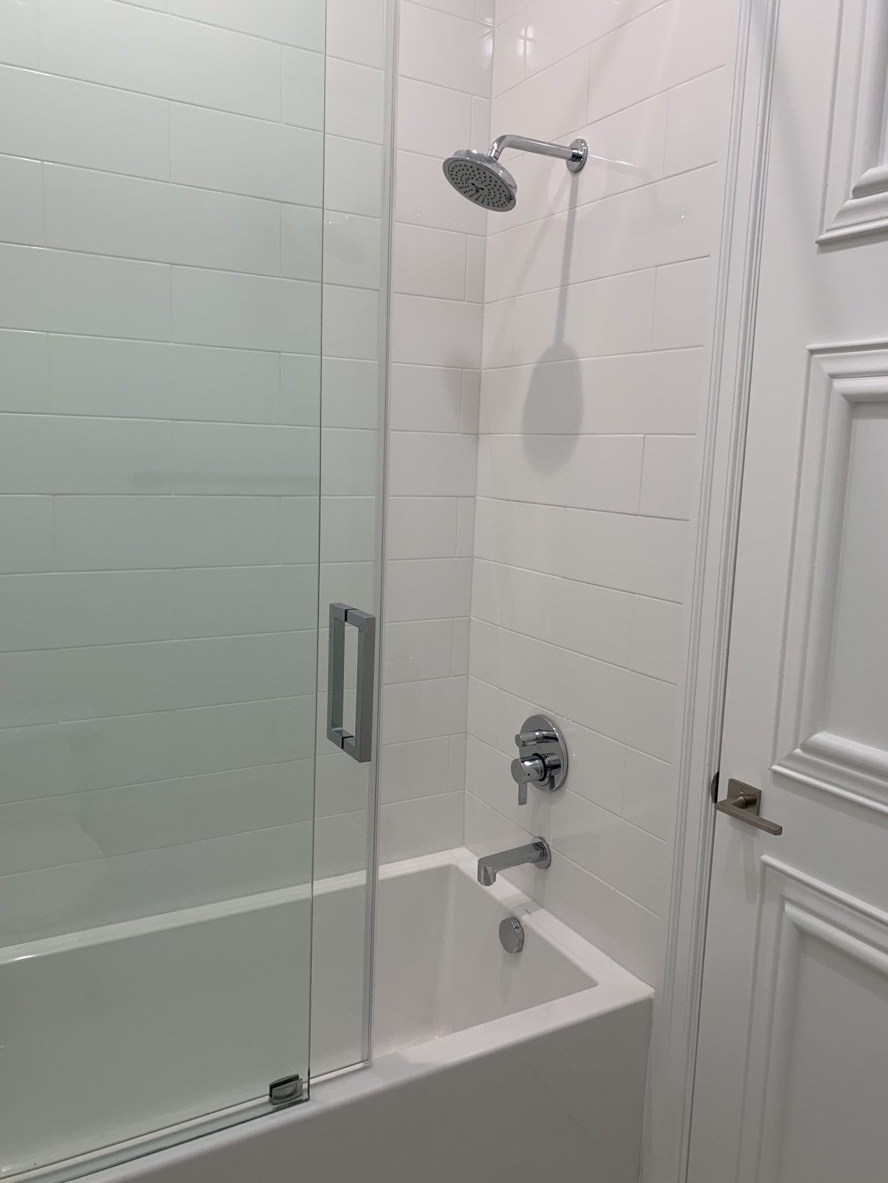 Renovated bathroom with subway tile walls in guest bedroom-2