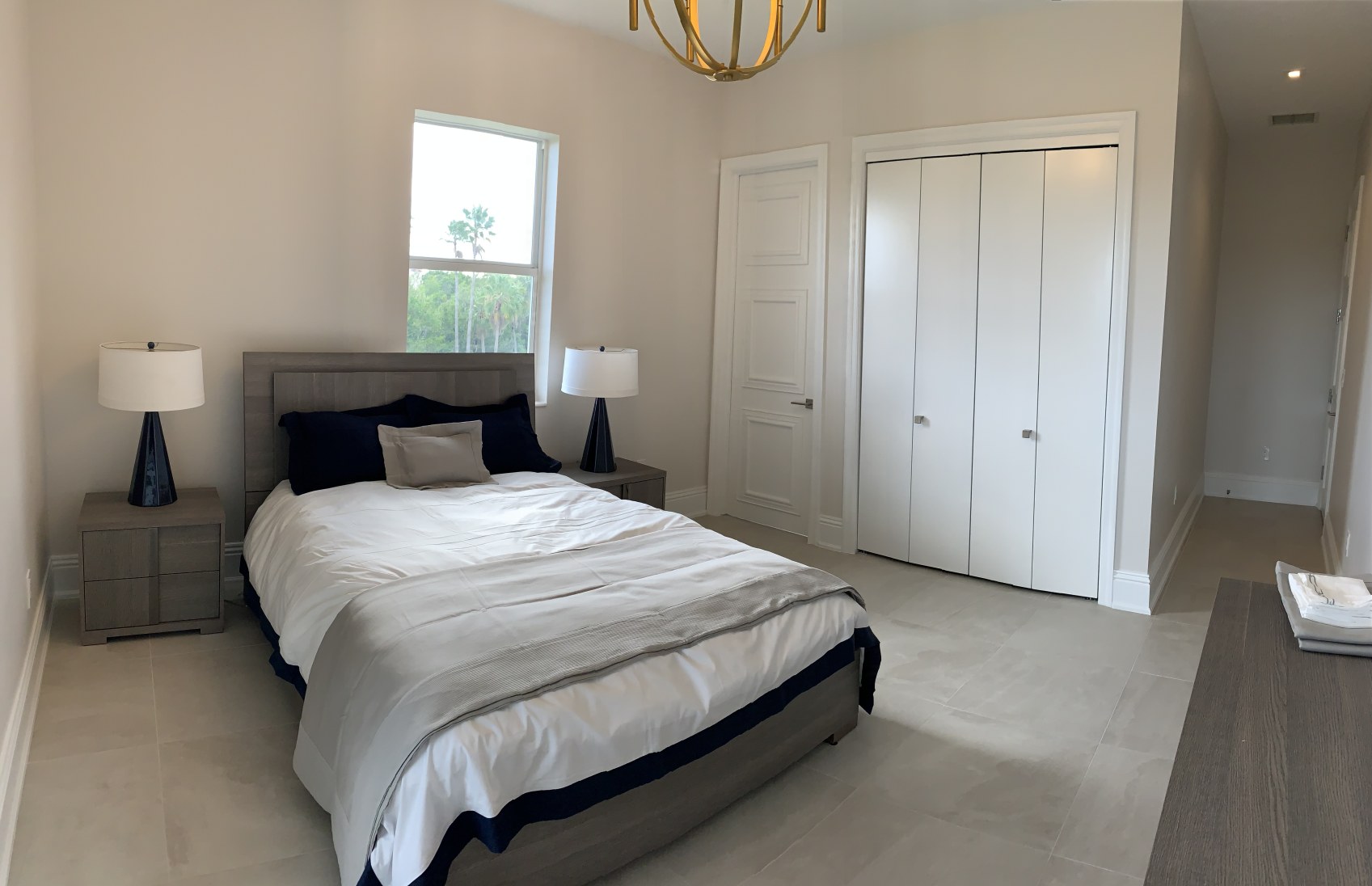 Guest bedroom-3 with porcelain floors & 8 ft. doors