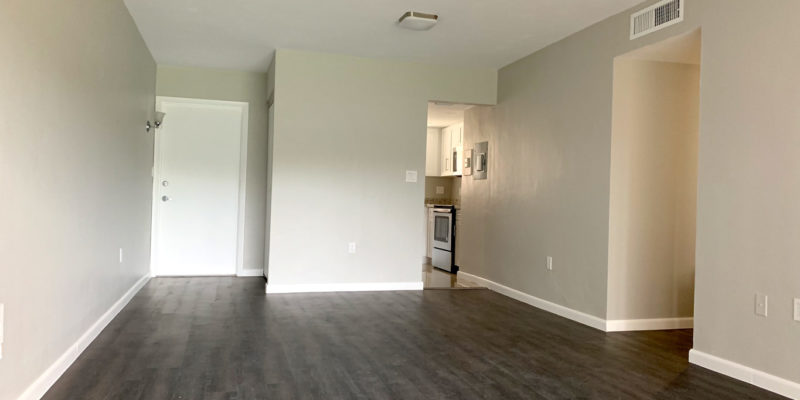 After photo of foyer and living room.