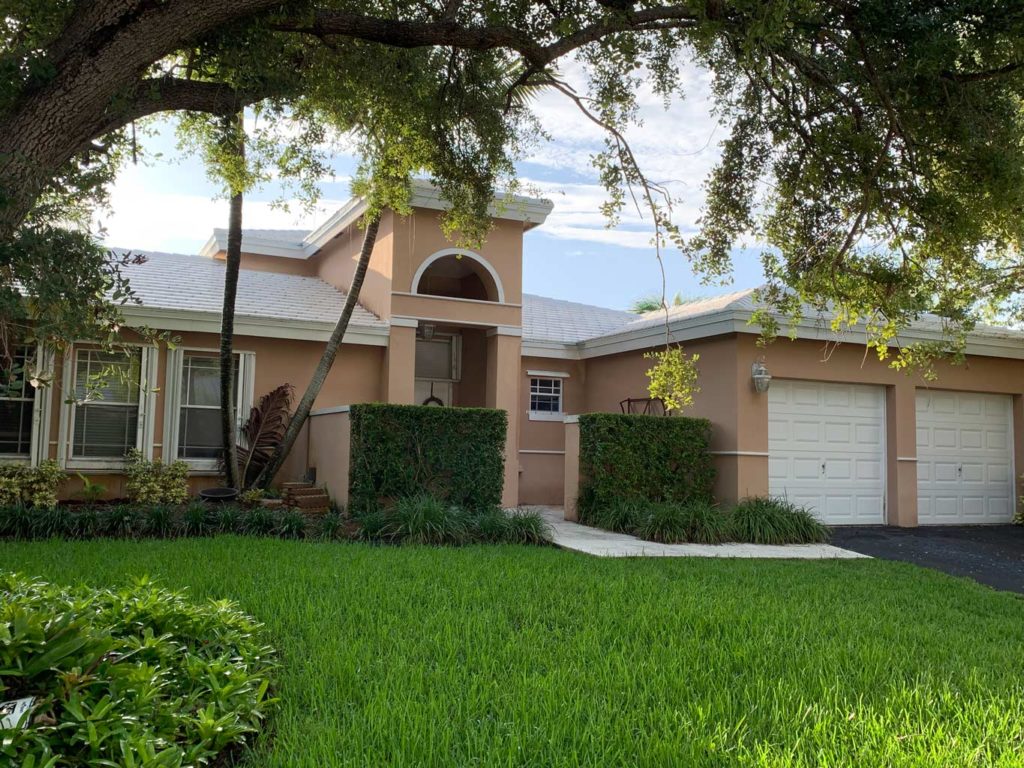 After photo of white tile roof installed.