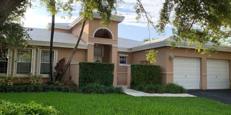 After photo of white tile roof installed.