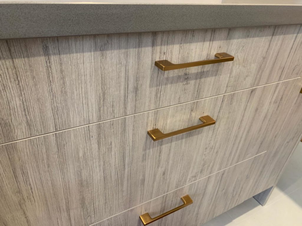 Close-up photo of brass cabinet handles