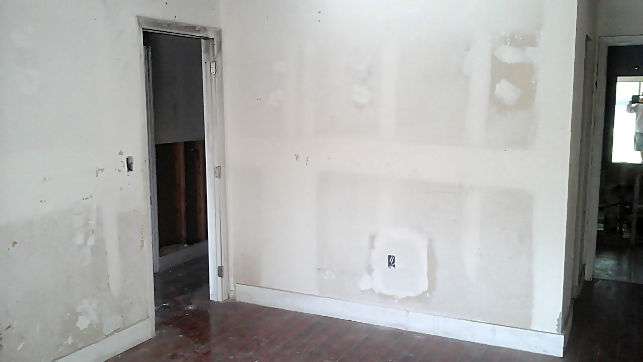Before photo of master bedroom with missing door and unfinished drywall