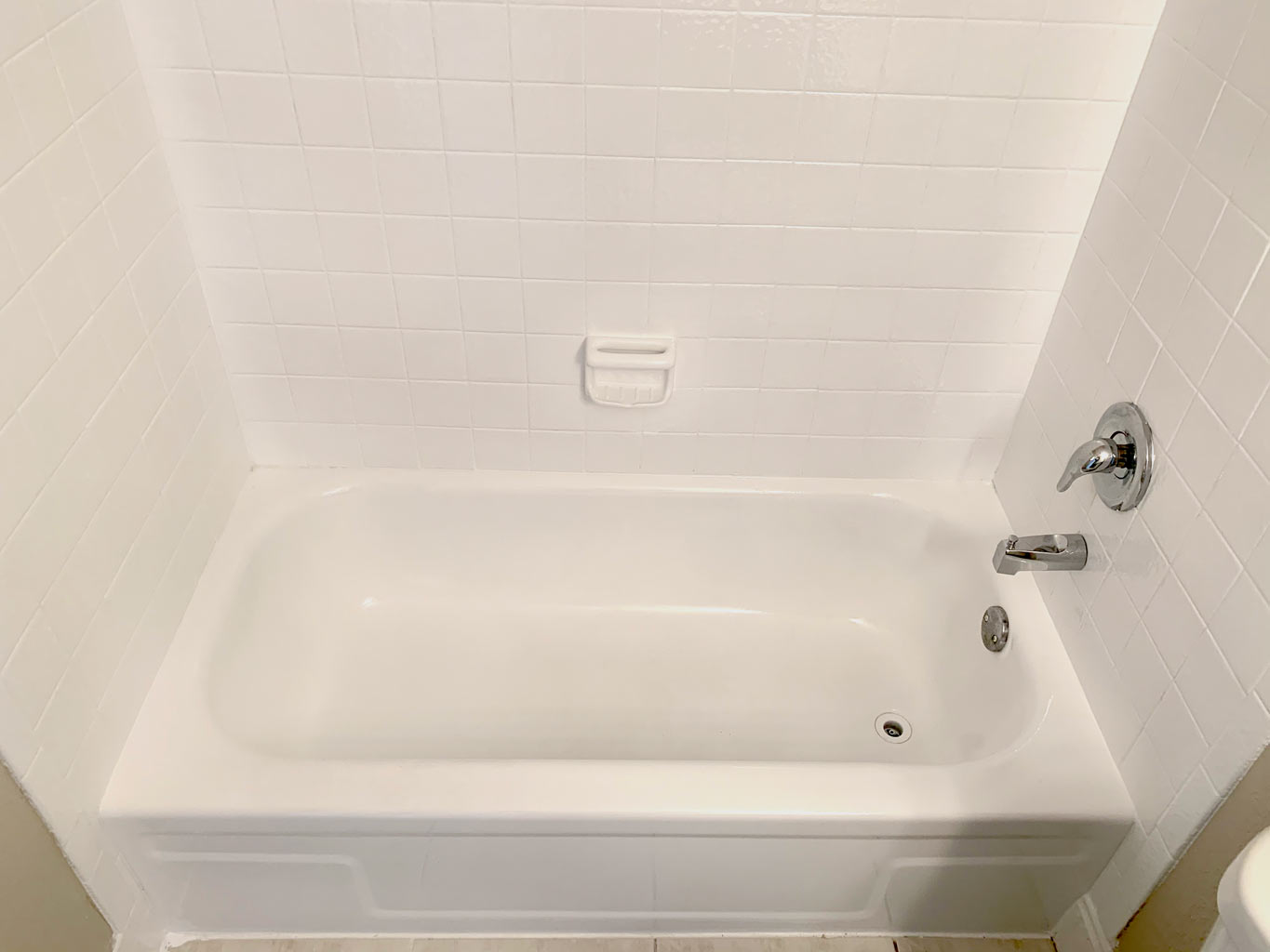 After photo of tub with new chrome shower valve kit