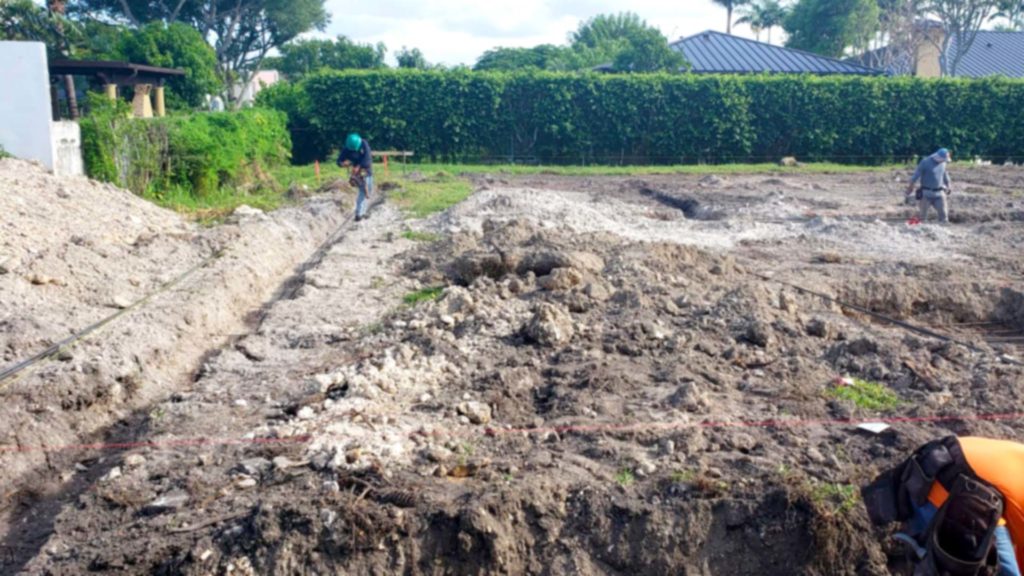 Photo of cleared lot with footing and foundation preparations in progress